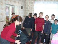 Boys wait patiently for their clothing.