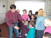 Thanks to Guy Moore, and his donation of clothes, the girls had ample supply to choose from.  Denis checks for sizes and passes