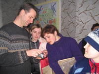 The older kids are fascinated with the digital camera.