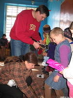 Denis assists with finding sizes.