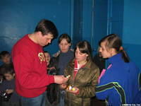 The girls return for some instruction on the personal care bags.