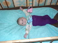 A common practice in orphanages is to string toys across the crib with elastic.