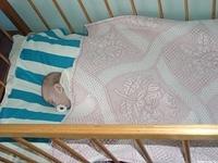 This baby is snug and warm in their blanket.