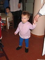 This little girl is walking on her own.
