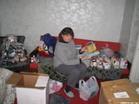 Board Member, Lynn sorts school supplies, and items for the personal care bags.
