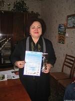 The director proudly shows the 3rd place district finish (out of 17 schools) for her boys basketball team.