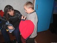 Children look through clothing and make choices.