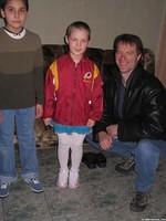 His Kids, Too! executive board member, Ray G. poses with some aide recipient's.