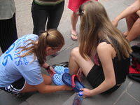 Jennifer assists with sizing Marcia's class