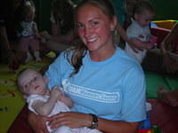 Jenn tenderly hold this little one.