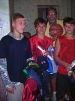 Rich with some of his 'campers' receiving clothing.