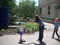 Haley plays 'bubbles' with one little boy.