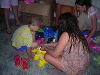 Lydia assists with finding Crocs for kids.