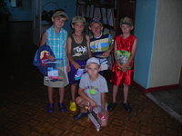 Kids received armfuls of clothing, Crocs, sport equipment, personal care bags, and more.