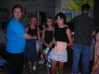 Kristy assists the teens with clothing choices.