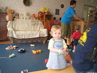 Because of your donations, this little girl has many choices of toys to play with.