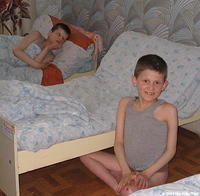 This boy was thirlled that I pointed the camera at him!  Here the children are preparing for a afternoon nap.