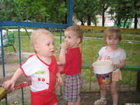 These 3 yr. olds enjoy outdoor play.