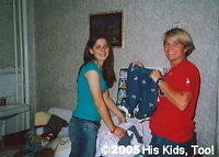 Haley and Karen sort clothes to match up outfits.