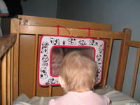 This little boy, just could not get enough of looking at himself.  Thanks to Neve and her friends, for the toys!