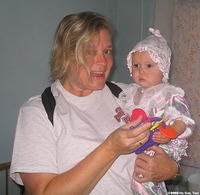 Kristy give this little girl a new toy.