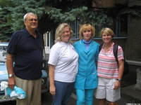Walter Lee, Kristy and Karen, poise with our friend, and head floor nurse for the orphan ward.