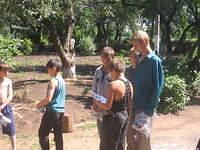 The teen boys inspect each bag.