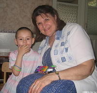 Kristina enjoys showing Lynn her gifts.