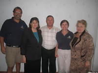 Director and assistant directors of the facility and of His Kids, Too!, along with board member Lynn A.