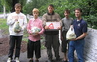 Some of the kids insisted on helping, Denis, Ray and Vanya with cookies and bananas.