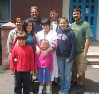 His Kids, Too! Fillmon family with the director of the facility.