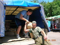 The vendor gives a helping hand.
