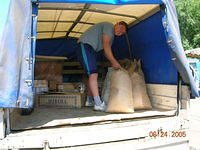 Vanya secures the bags on the truck.