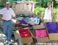 Ron and Mary D. of South Trail Church of Christ deliver over 150 blankets, clothing, toys and shoes to be shipped to Ukraine for