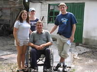 U.S. and Ukrainian volunteers deliver food to this disabled gentleman.