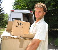 David assists in unloading aide to an orphan facility, in Ukraine.