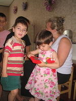 This brother and sister enjoy their new toys, and isn't she precious in her new dress, thank you Anna.