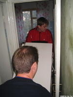 Moving a donated refrigerator for an elderly woman in Ukraine, she was thankful.