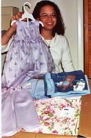 One of our many donors, Anna with some of the hundreds of pieces of clothing she purchased and donated to help orphans.