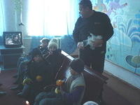 Rich passes out fruit to the children of the Novroghosk Internat, one of the poorest facilities we assist.