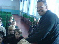 Rich greets the children.