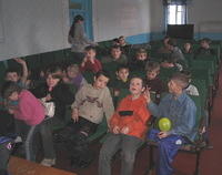Kids listen attentively to the lesson.