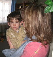 Rita enjoys talking with this little boy.