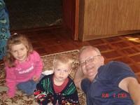 Two of the kids with missionary Doug B., donation deliverer.