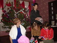 The kids and 'parents' are overwhelmed at the gifts.