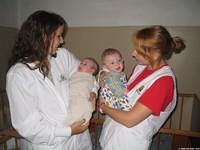 Lydia and Ashley hold some of the babies.