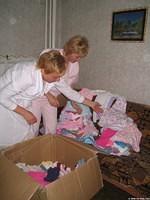 The ladies were happy to recieve new clothing for the children.
