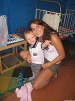 Haley is busy dressing children in new clothing.