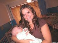 In the background you can see all the great cribs!  Lydia soothes a crying baby.