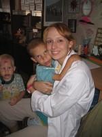 This 8 yr. old boy won't let go of Ashley.